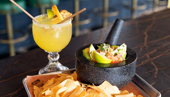 Margarita, fresh made chips and homemade guacamole served at The Million Roadhouse