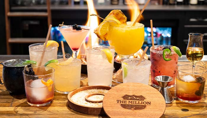 Full bar with alcoholic drinks and specialty cocktails at The Million Roadhouse restaurant bar and grille in Ridgway, CO